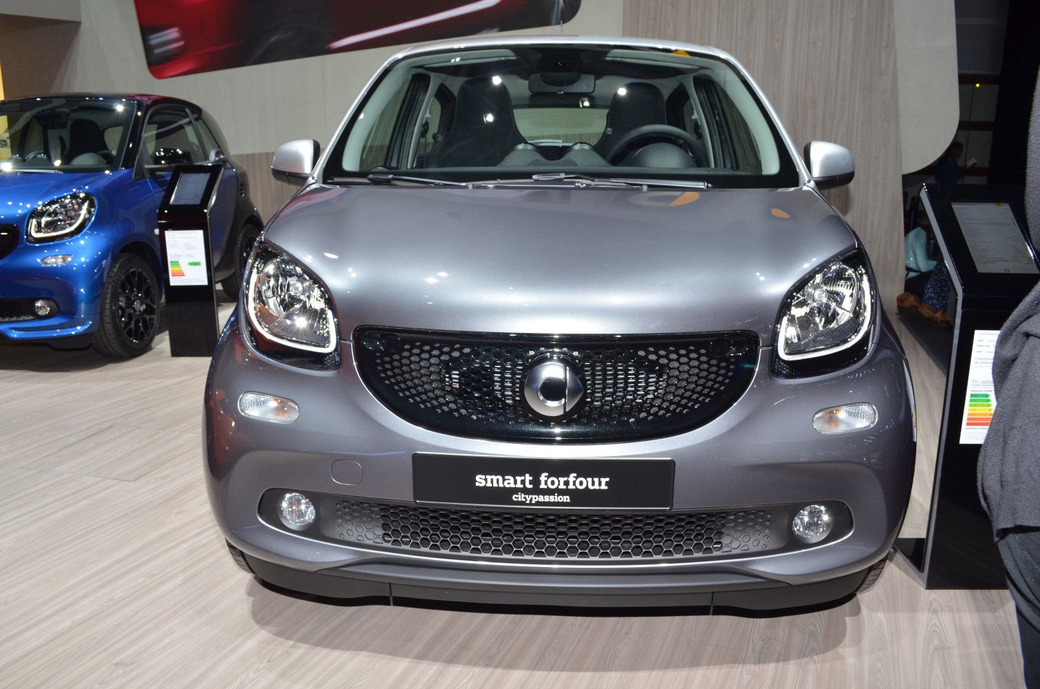 Front view of compact city car with distinctive grille and headlights.