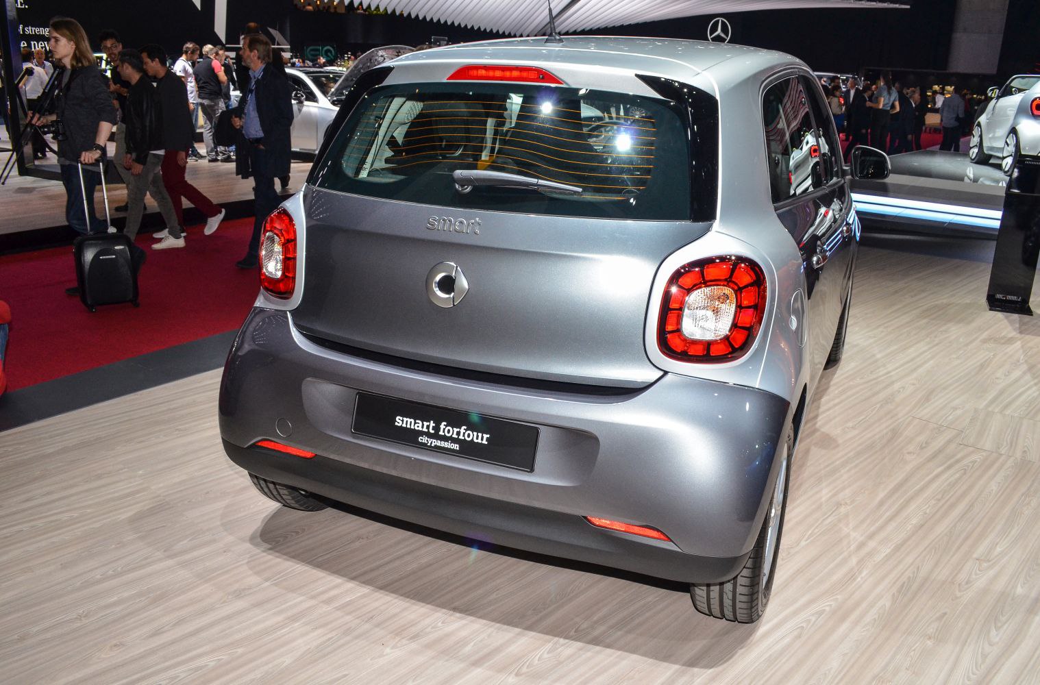Rear view of hatchback with distinctive taillights and rear window wiper