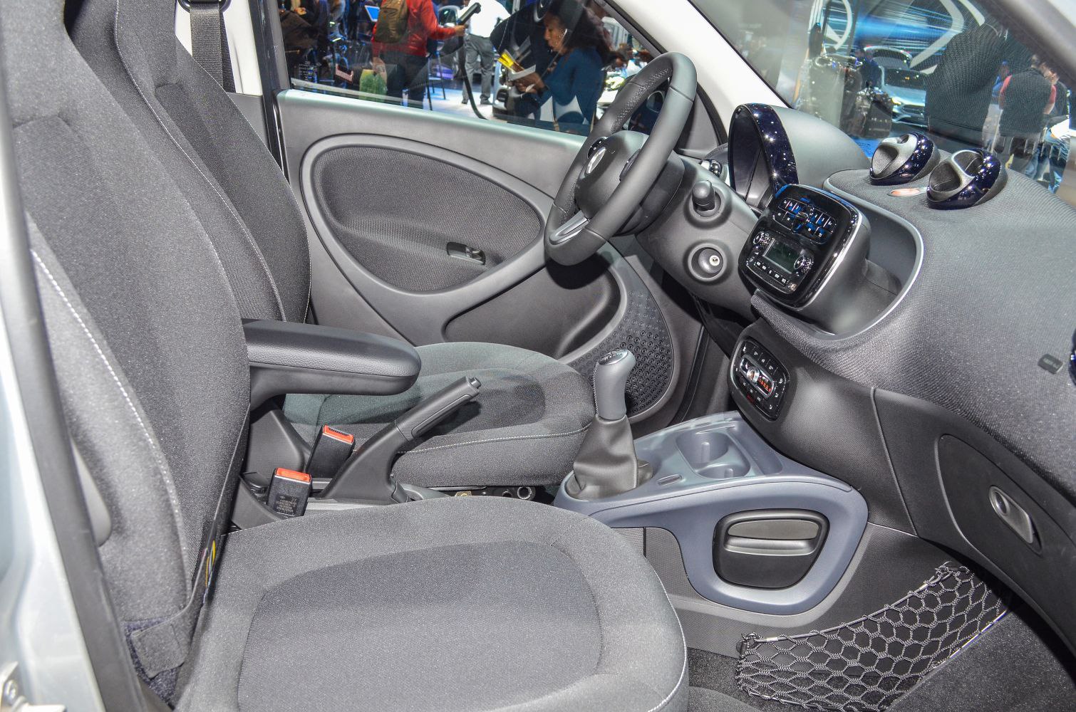 Manual transmission interior with ergonomic seats and functional dashboard