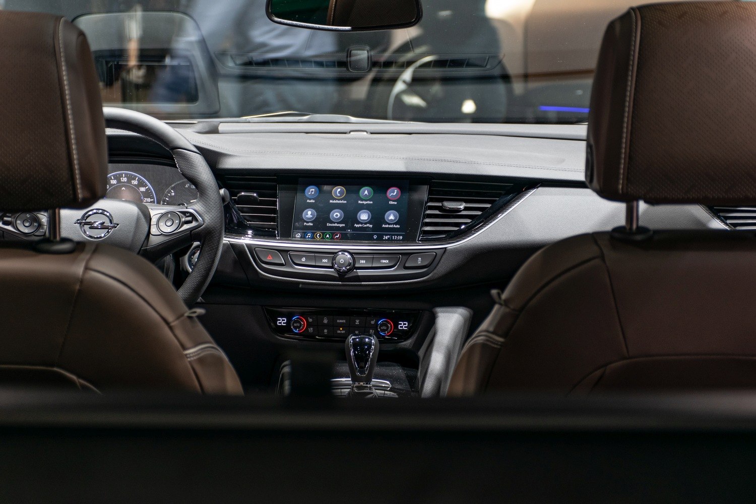 Digital infotainment touchscreen and climate control panel in modern vehicle interior