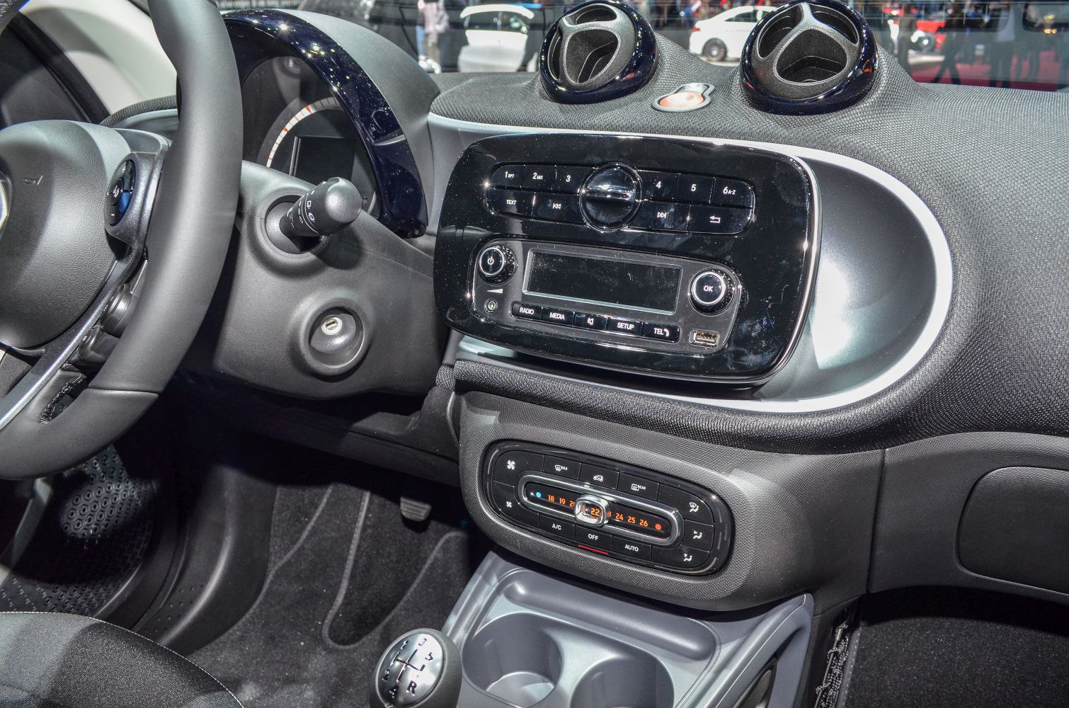 Dashboard center console and climate control panel with gear shift