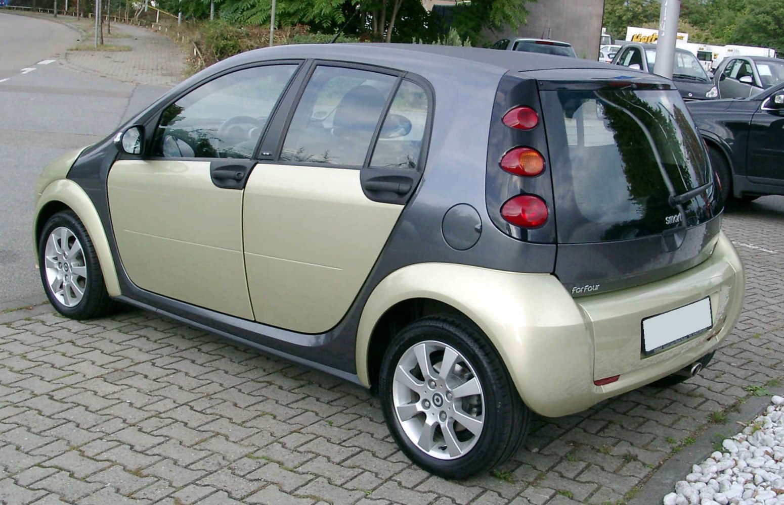 Rear side view of 5-door compact hatchback with vertical tail lights