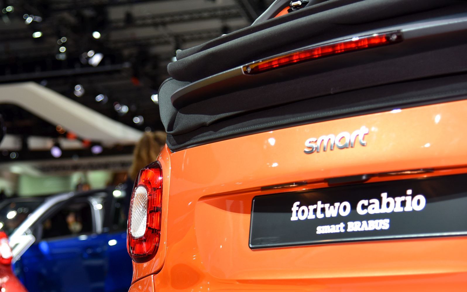 Close-up of orange rear tail light and soft convertible top