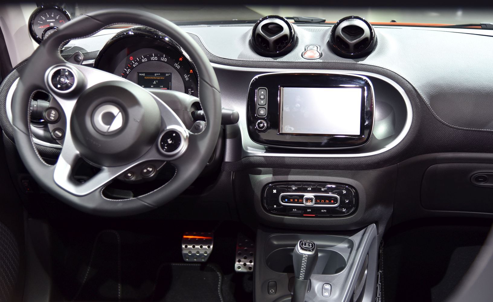 Steering wheel and dashboard with infotainment and climate control