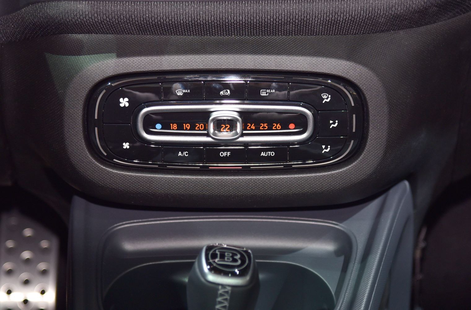 Digital climate control panel with temperature and airflow settings.