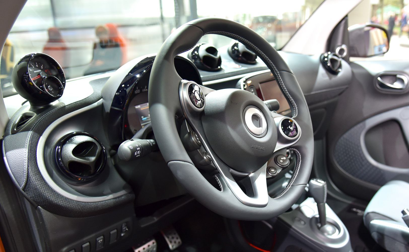 Steering wheel and dashboard with detailed control layout