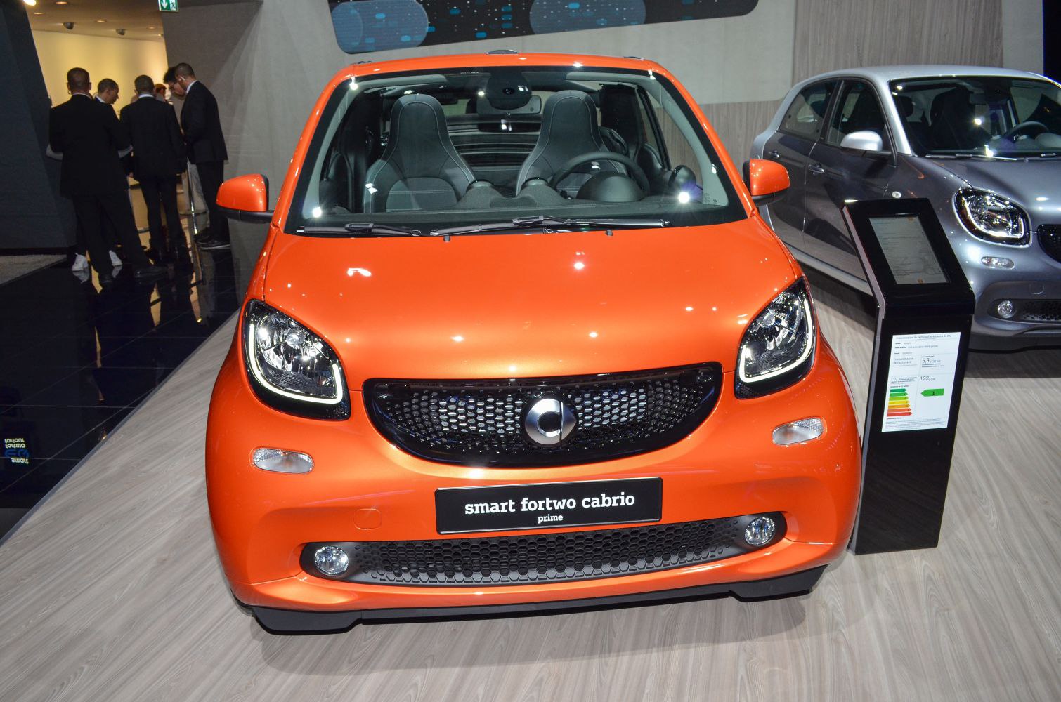 Compact front view of orange small city convertible with LED headlights