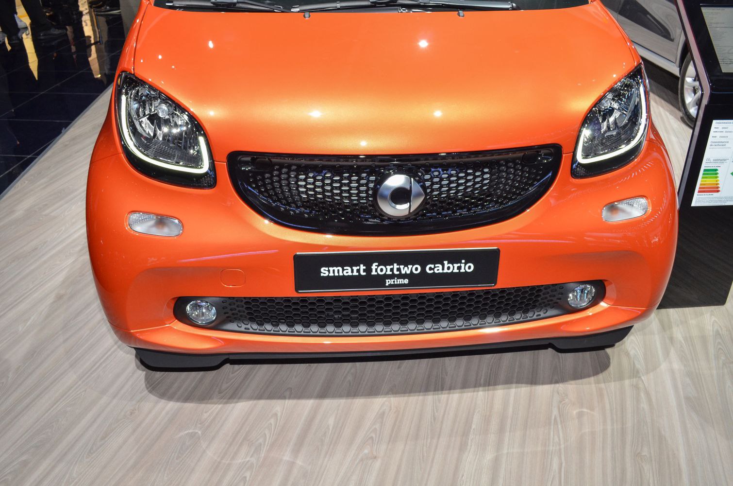 Close-up of front grille and headlights of compact vehicle
