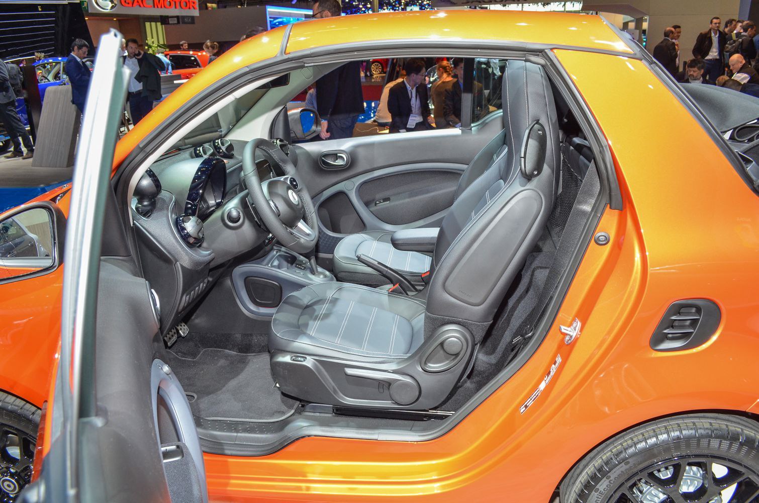 Open driver door showing seats and dashboard interior