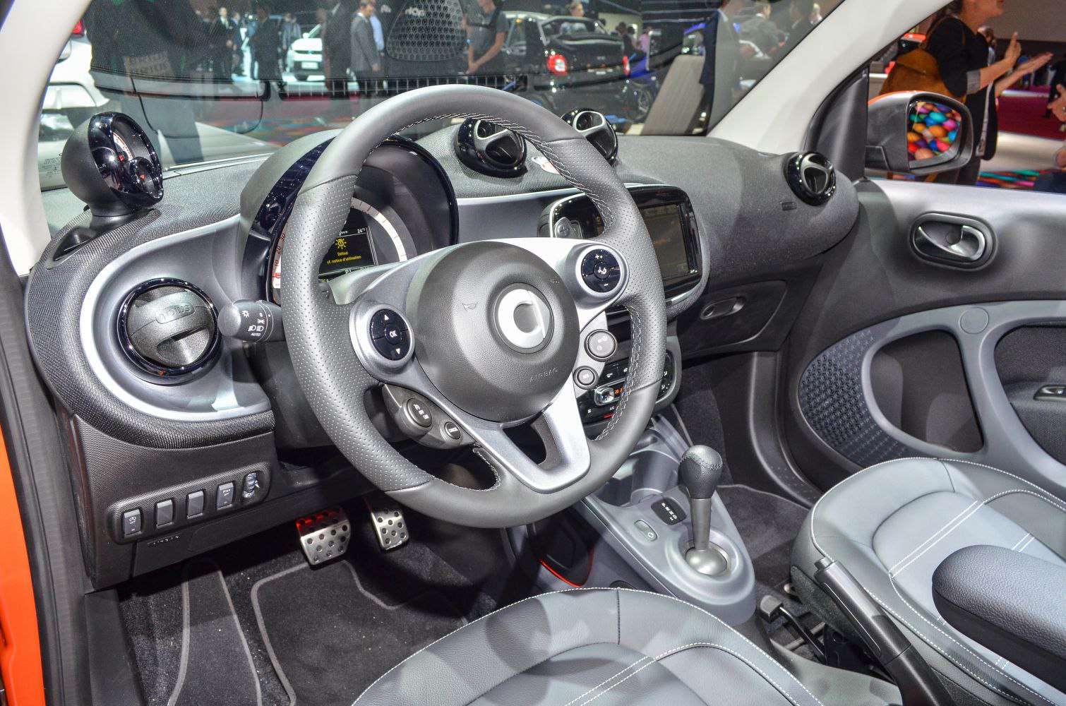 Dashboard and steering wheel with pedals and infotainment center