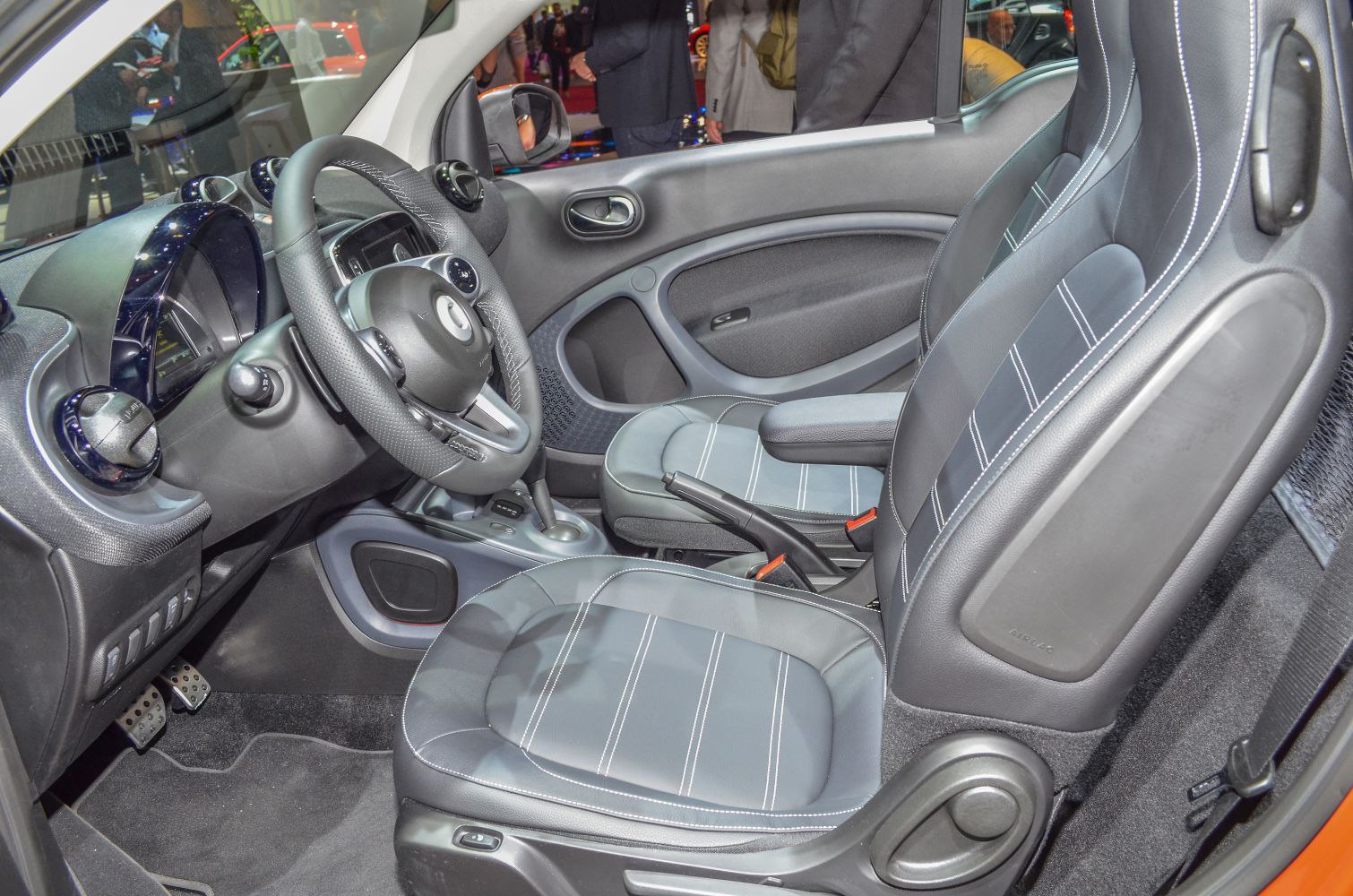 Steering wheel and front seat upholstery with detailed stitching