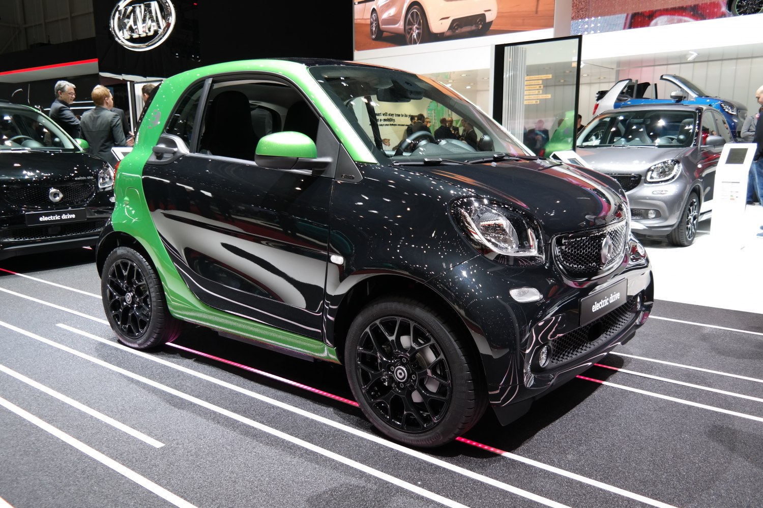 Compact electric vehicle with two-tone paint and black alloy wheels