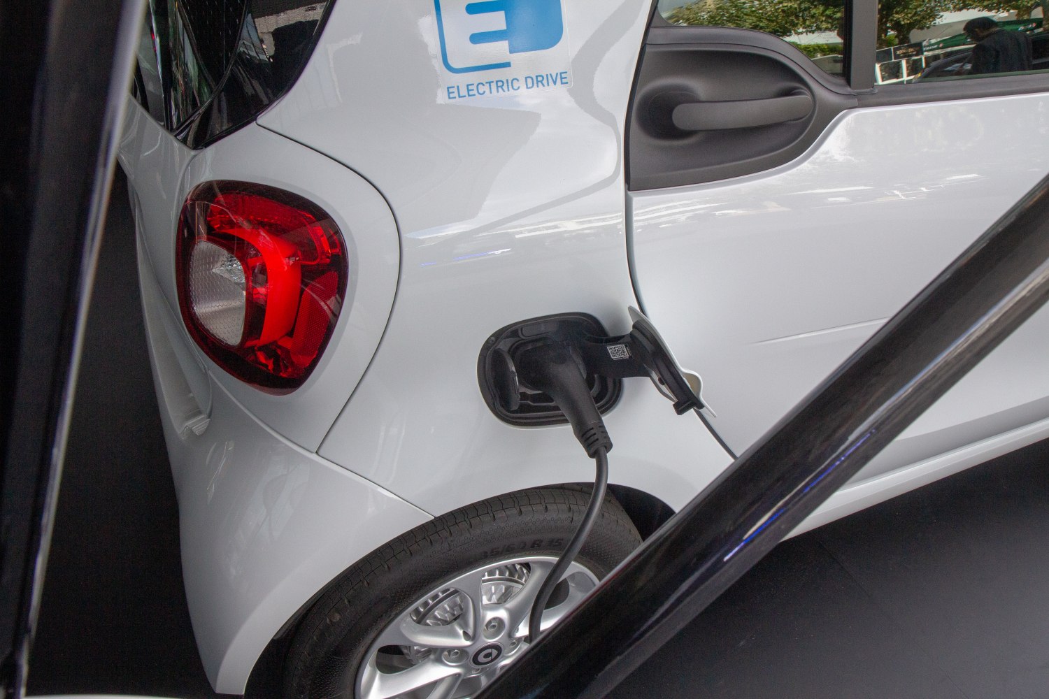 Electric charging port and rear side features of small electric vehicle