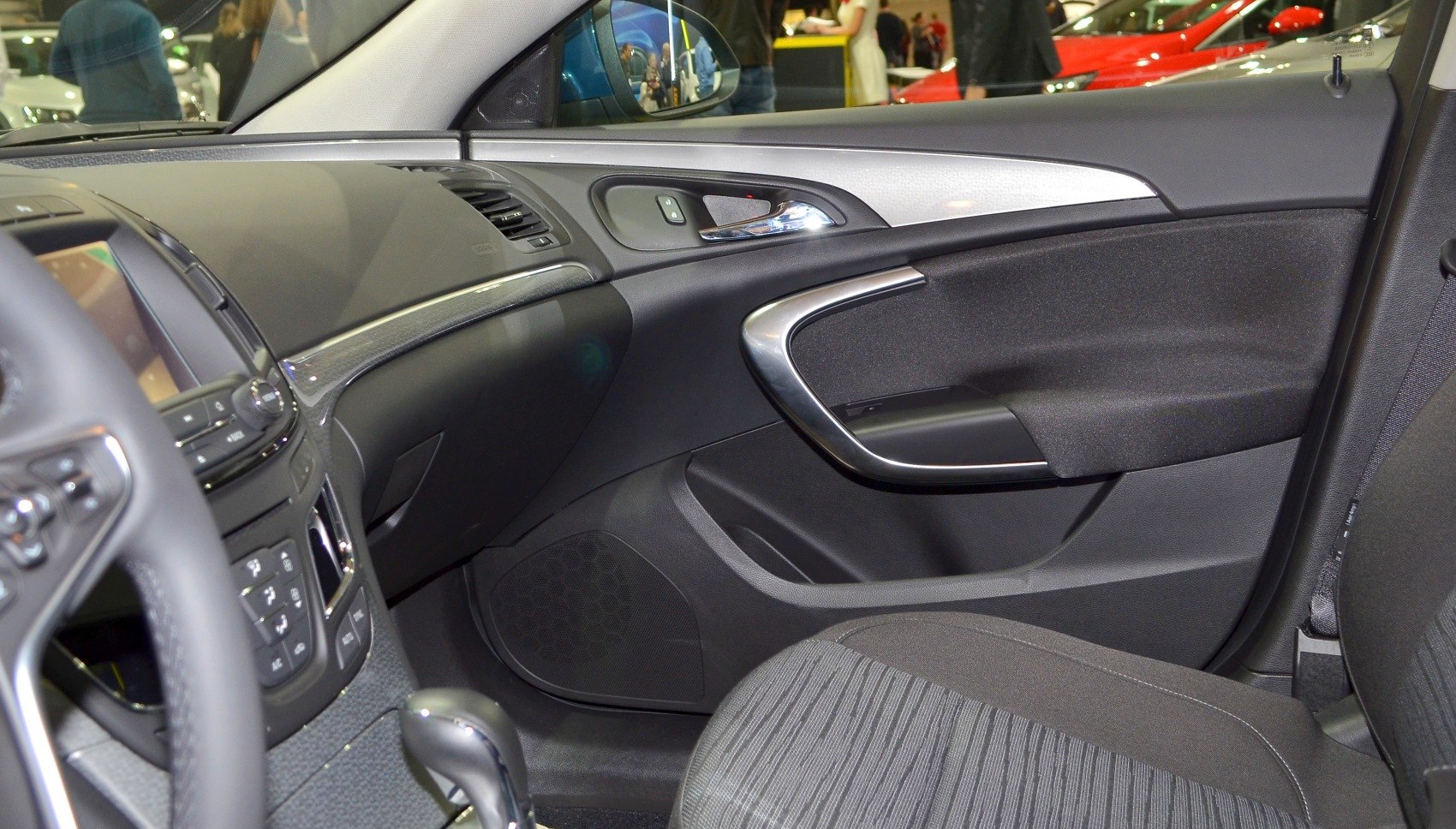 Interior door panel and dashboard with sleek trim and control buttons