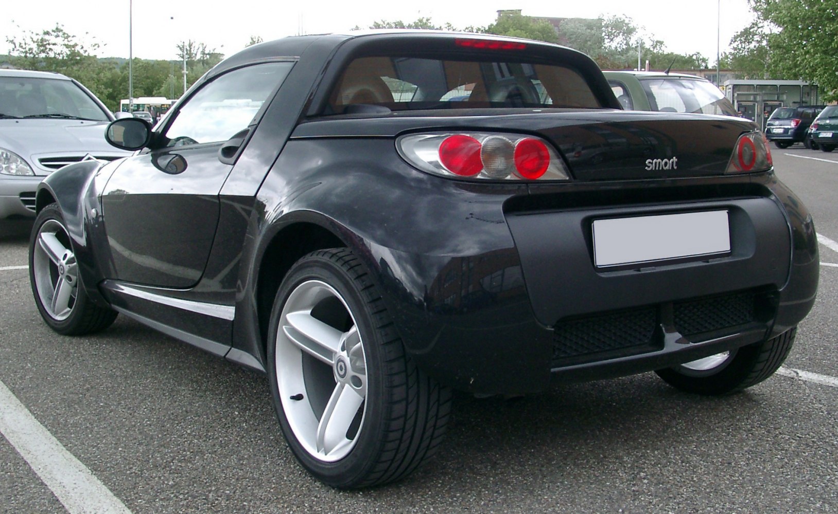 Rear view with distinct tail lights and silver alloy wheels