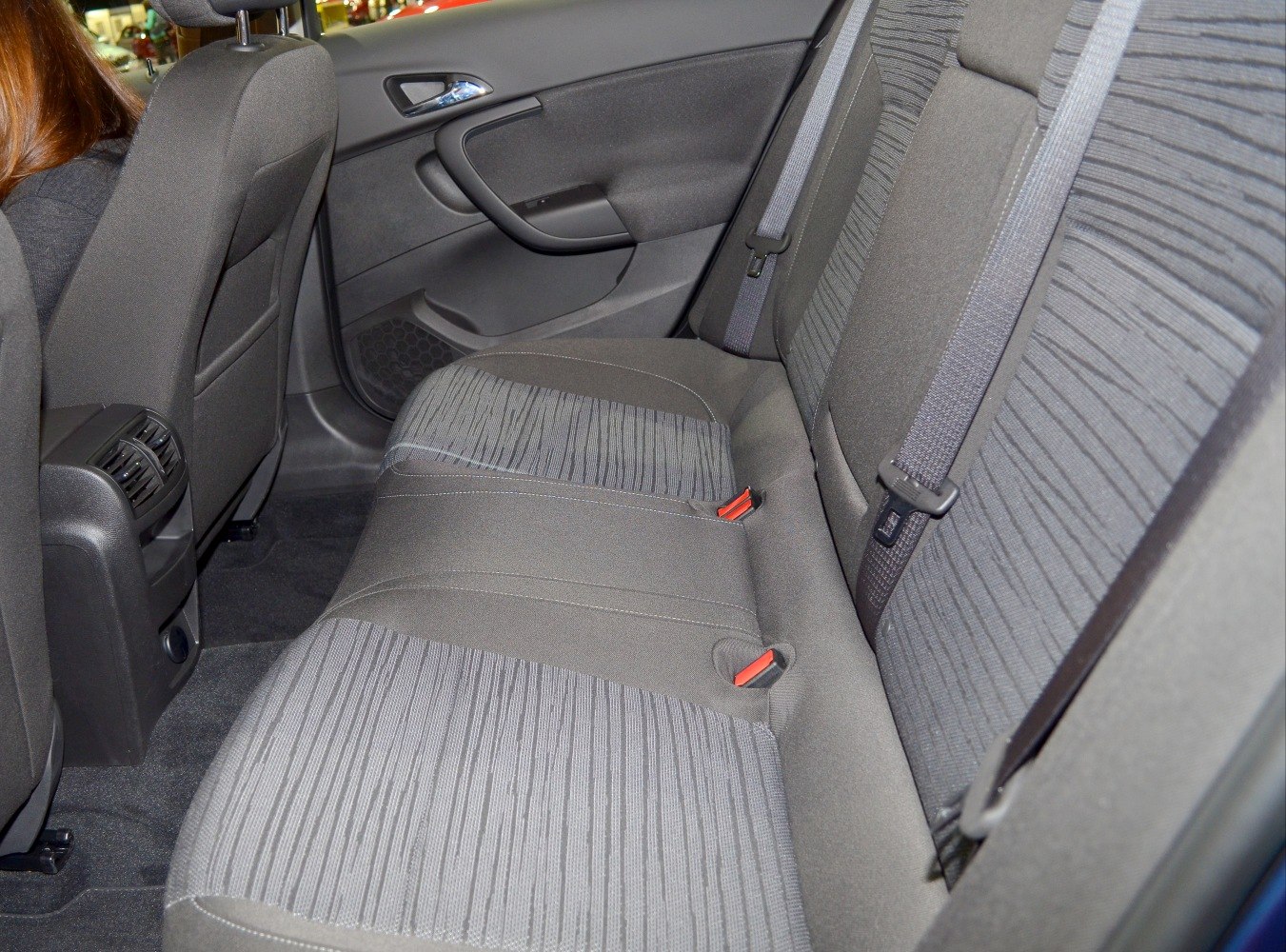 Rear seat fabric upholstery with seatbelts and door panel