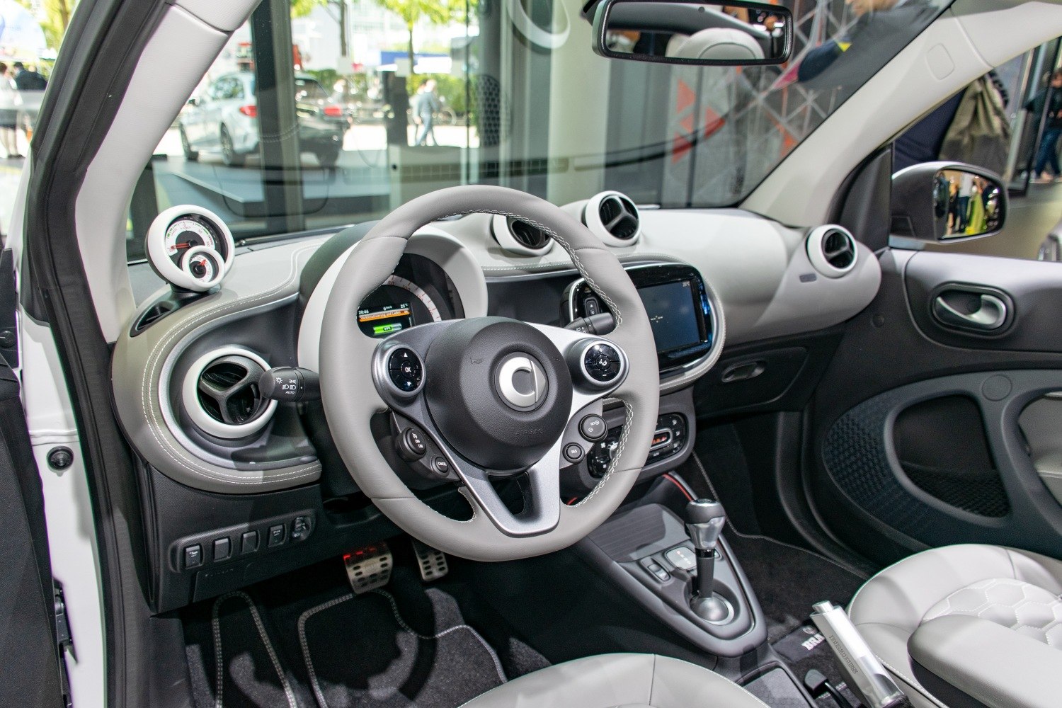 Modern interior dashboard with steering wheel and digital display