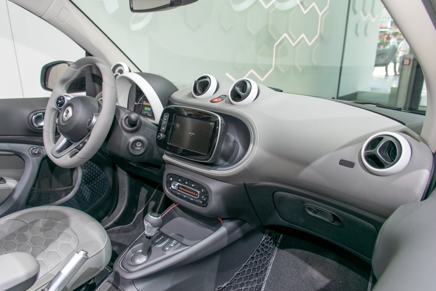 Modern dashboard with touchscreen infotainment and stylish circular air vents