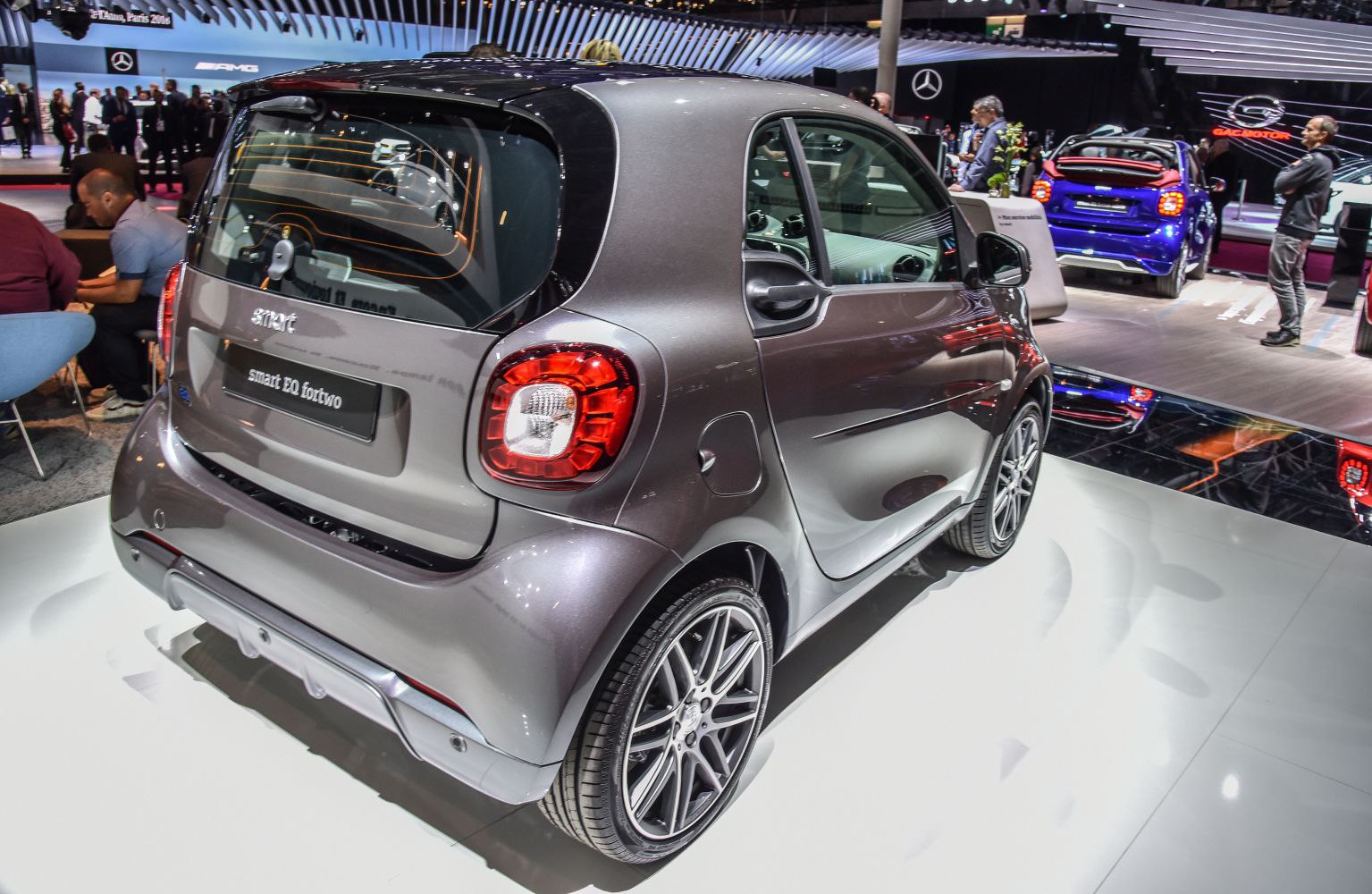 Rear perspective of compact electric hatchback with prominent taillights and alloy wheels