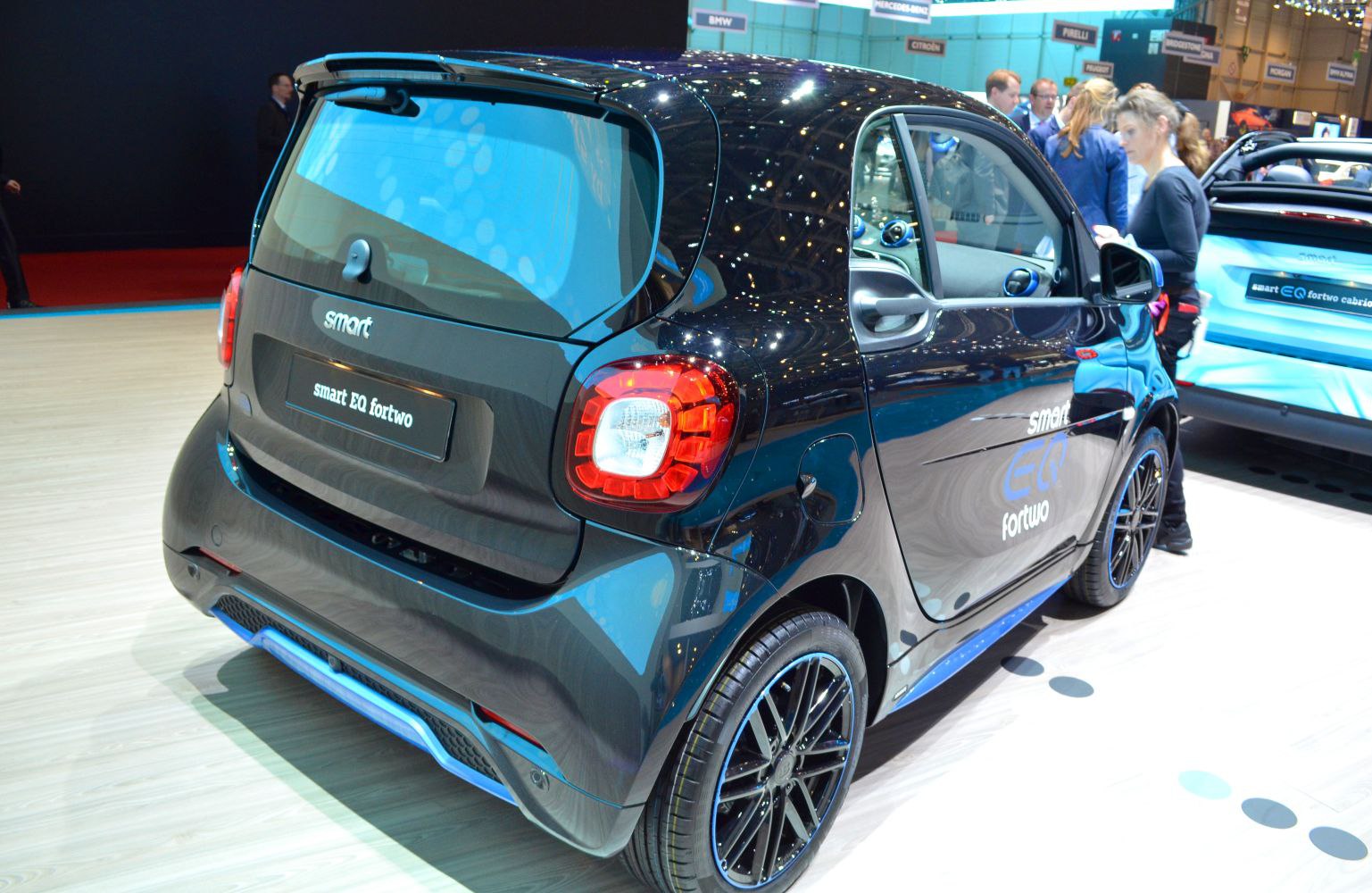 Rear and side design of compact electric hatchback with distinctive taillights and alloy wheels