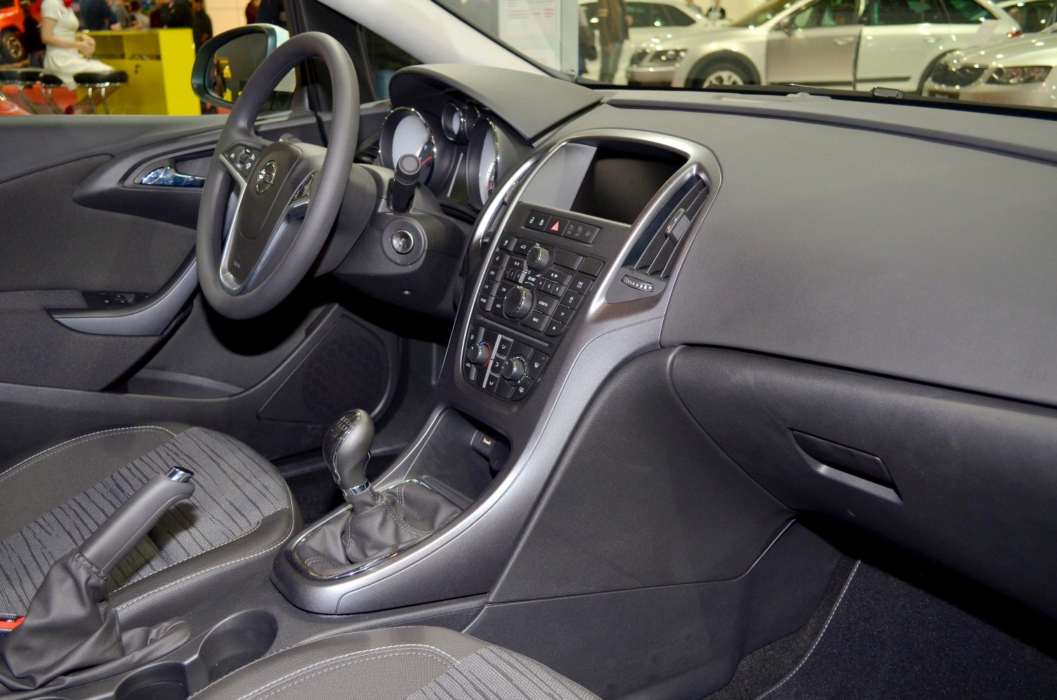 Modern car interior with dashboard, steering wheel, and manual gearshift