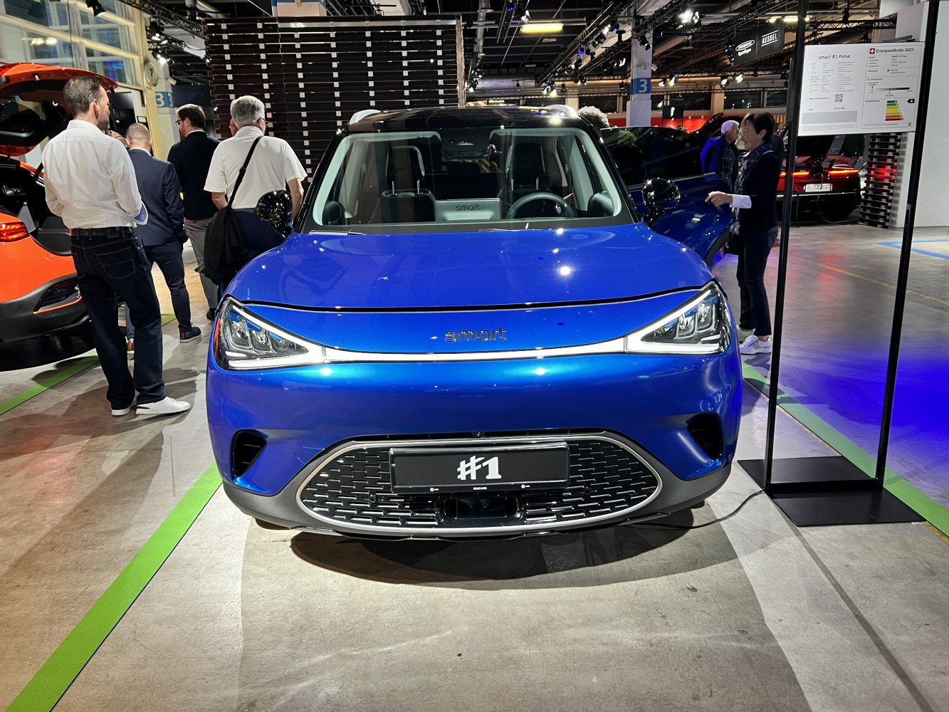 Front view of electric SUV with LED headlights and modern grille