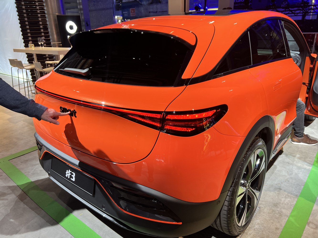 Sleek rear design with LED taillights and rear spoiler.