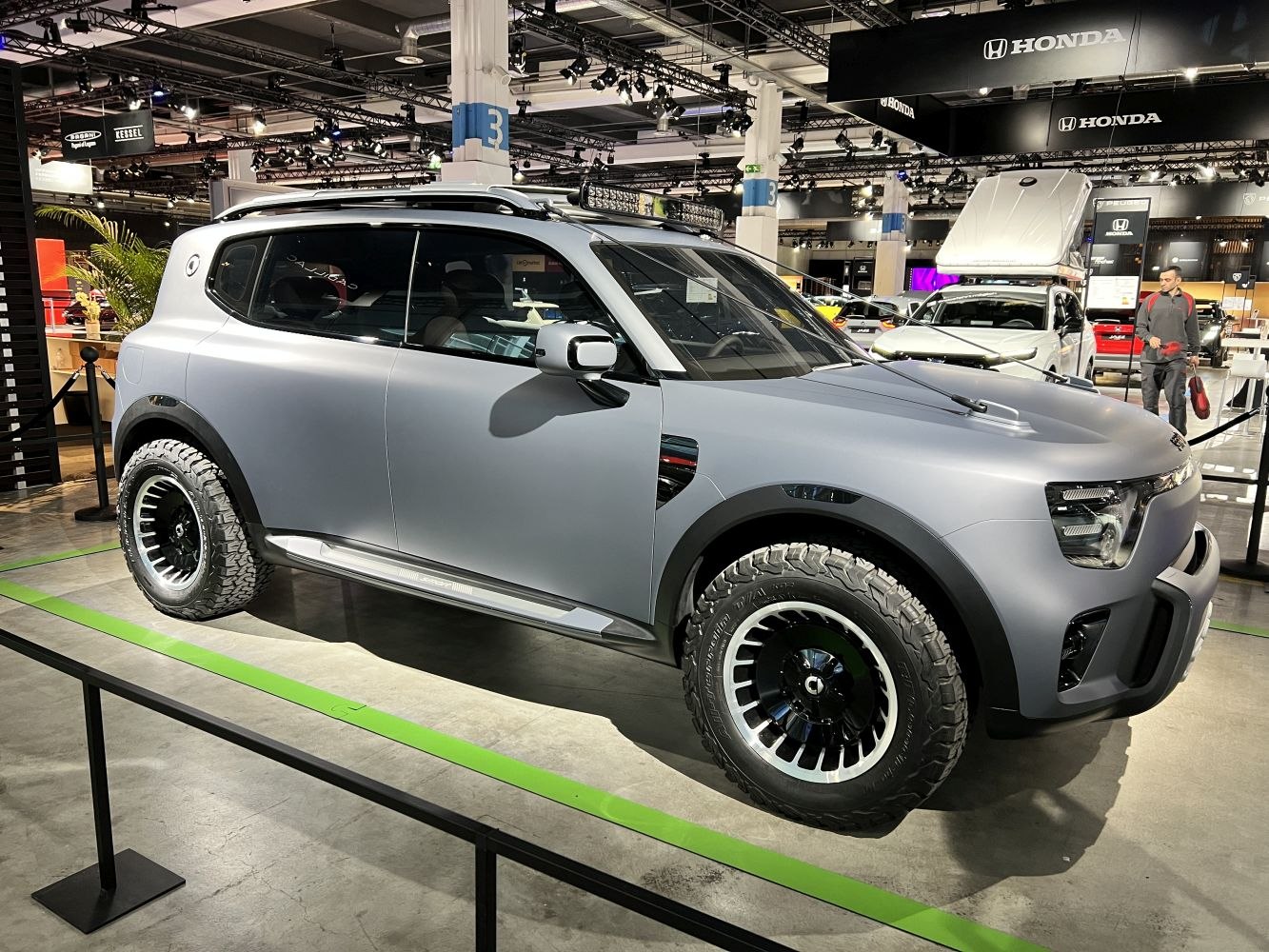 Rugged SUV with off-road tires and roof rack light bar