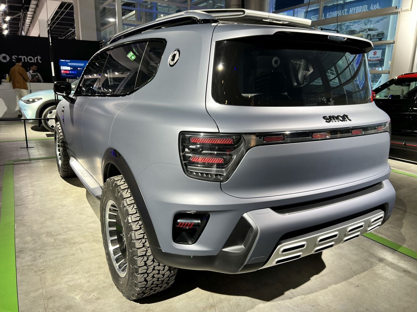 Rear and side view with off-road tires and modern taillights