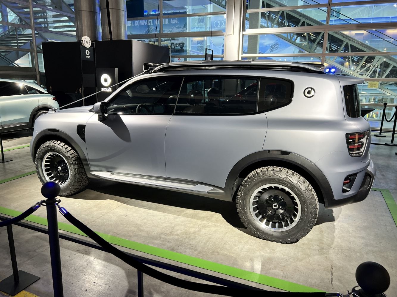Electric compact SUV with off-road tires and matte finish