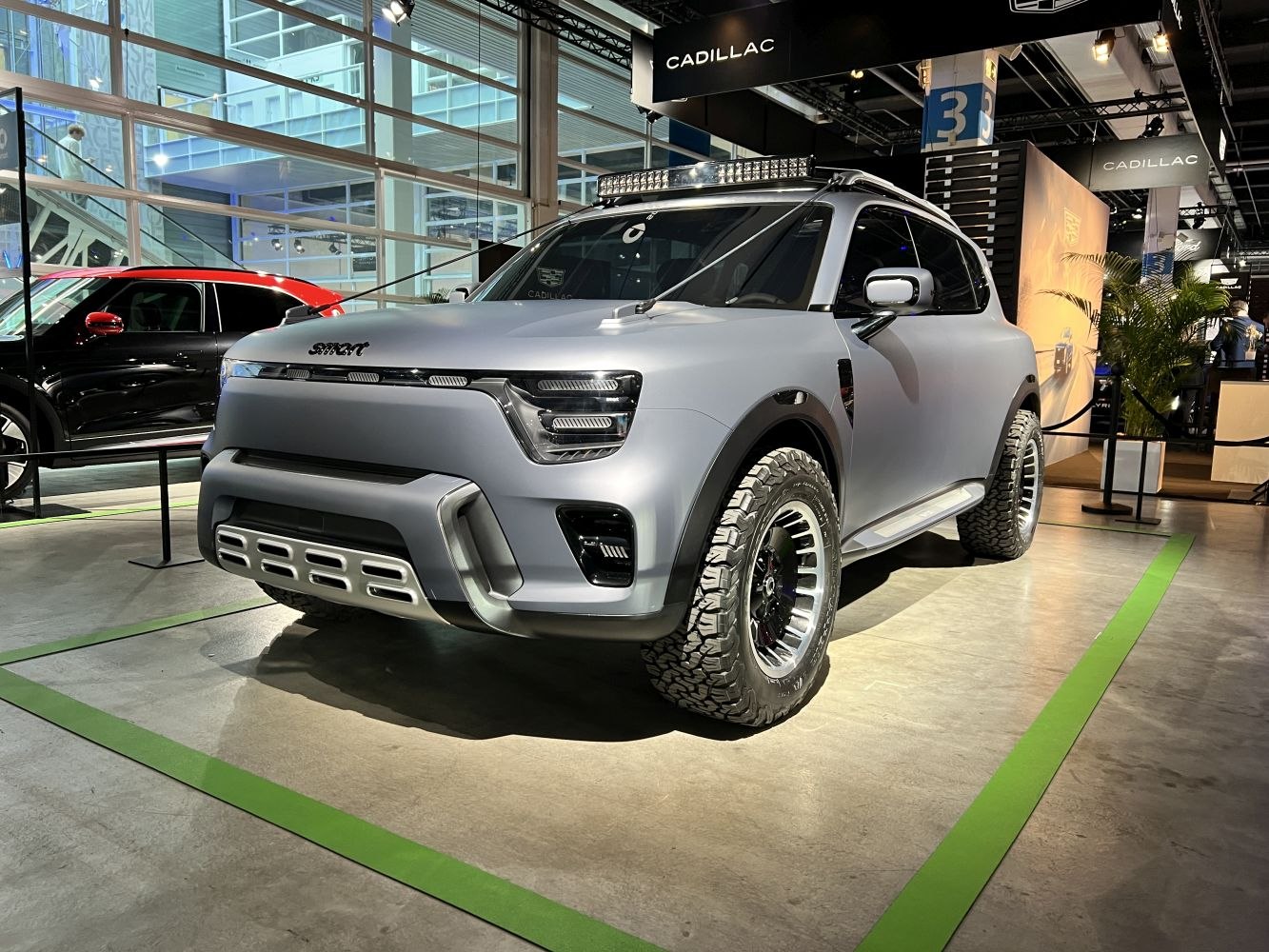 Rugged compact SUV with off-road tires and LED roof light bar