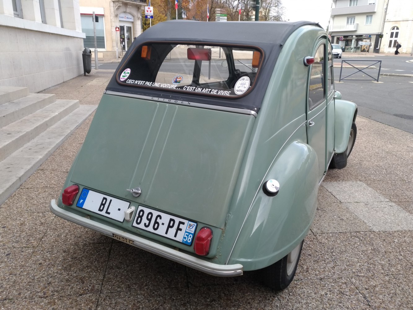 Rear view of classic Citroen 2 CV with soft top and vintage taillights