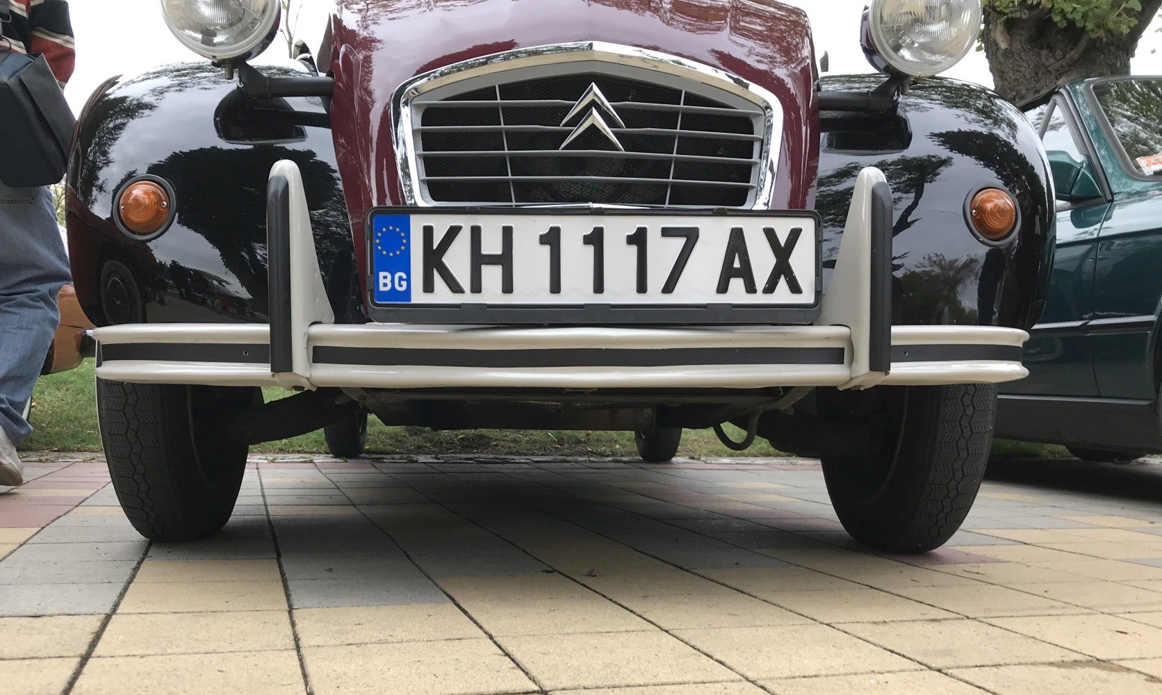 Classic vintage car front with distinctive grille and round headlights