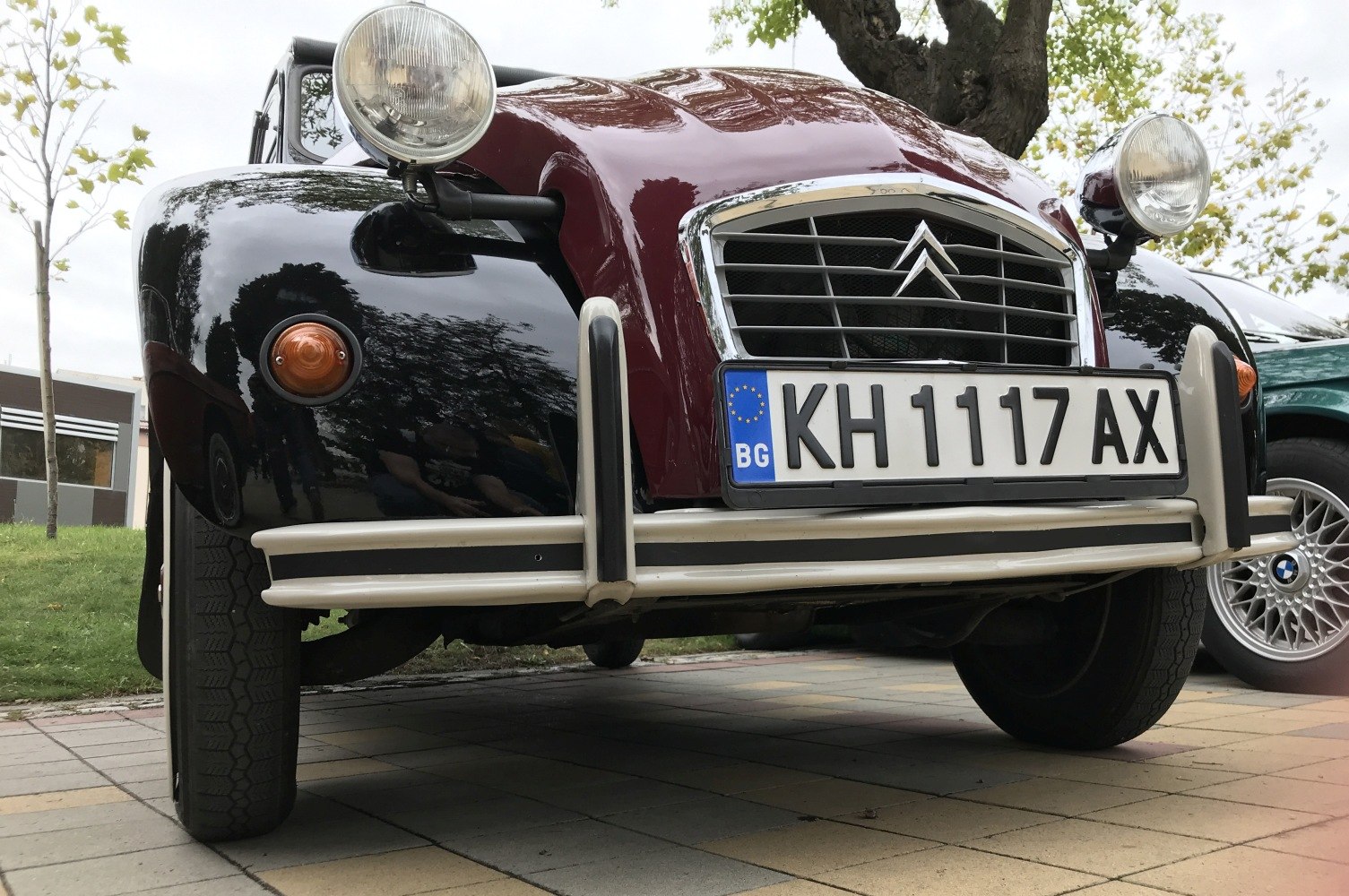 Small vintage front grille with round headlights and chrome bumper