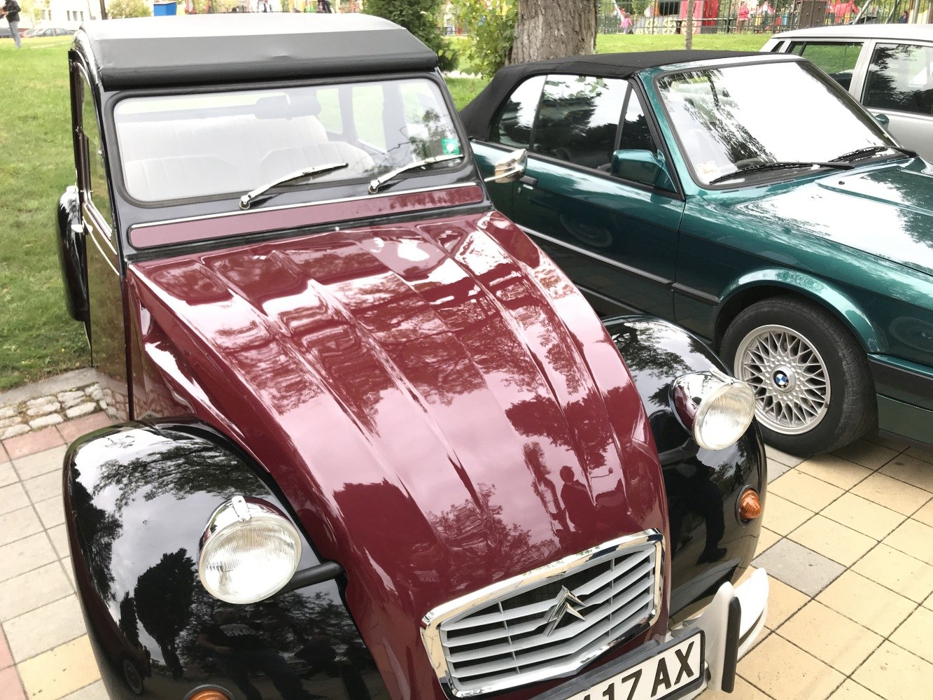 Front view with round headlights and chrome-accented grille.
