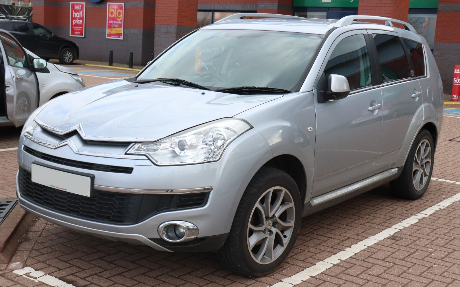 Silver SUV with modern headlights and alloy wheels