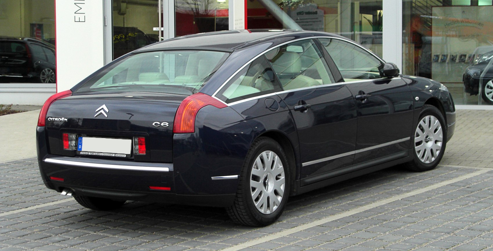 Luxury sedan rear with distinctive taillights and chrome trim