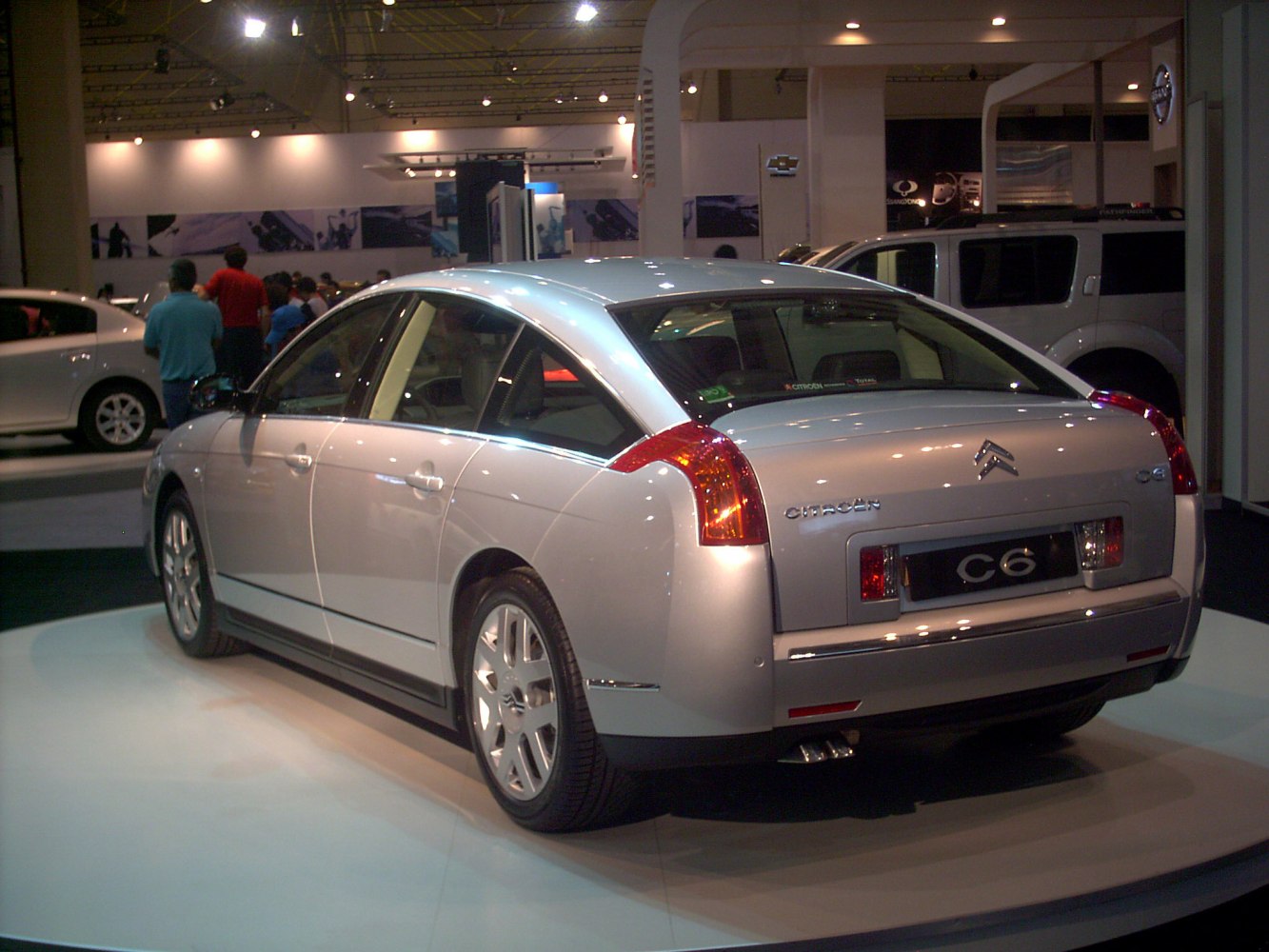 Rear view of classic sedan with distinctive tail lights and sloped rear window