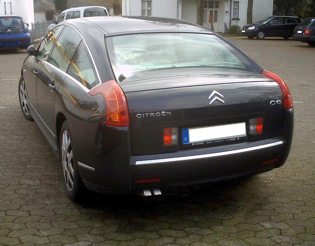 Tall vertical tail lights and wide rear window on a sedan's rear