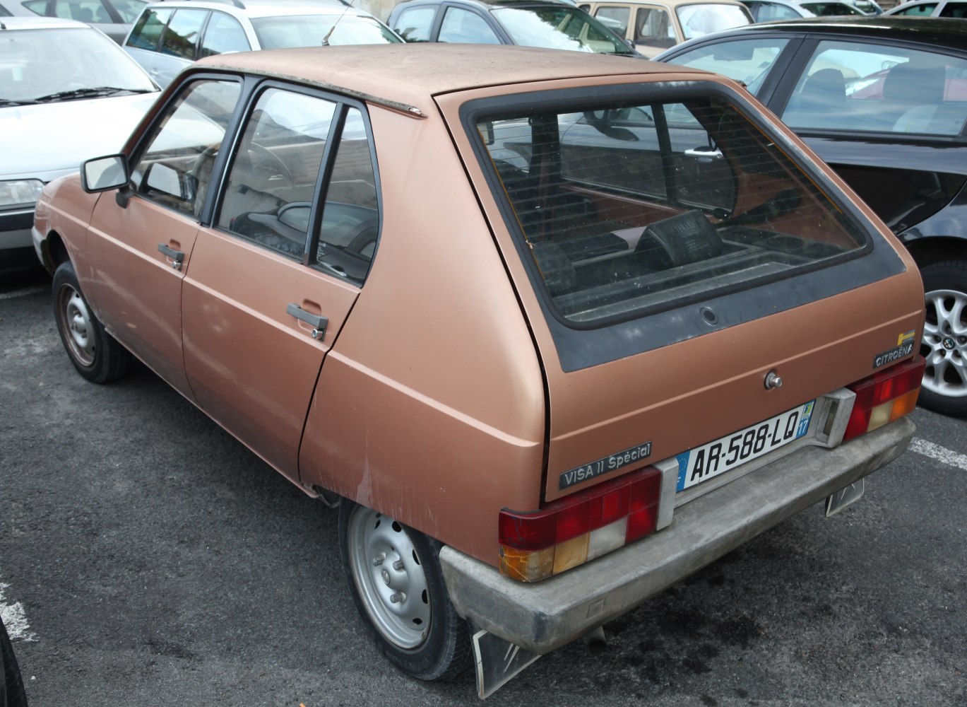 Rear and side view of classic hatchback with distinct taillights and window design