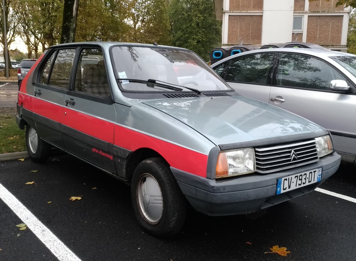 1980s hatchback with red side stripe and vintage styling