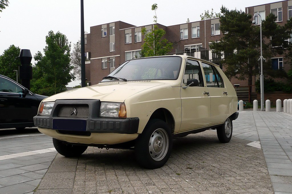 Boxy hatchback with distinctive front grille and classic wheels