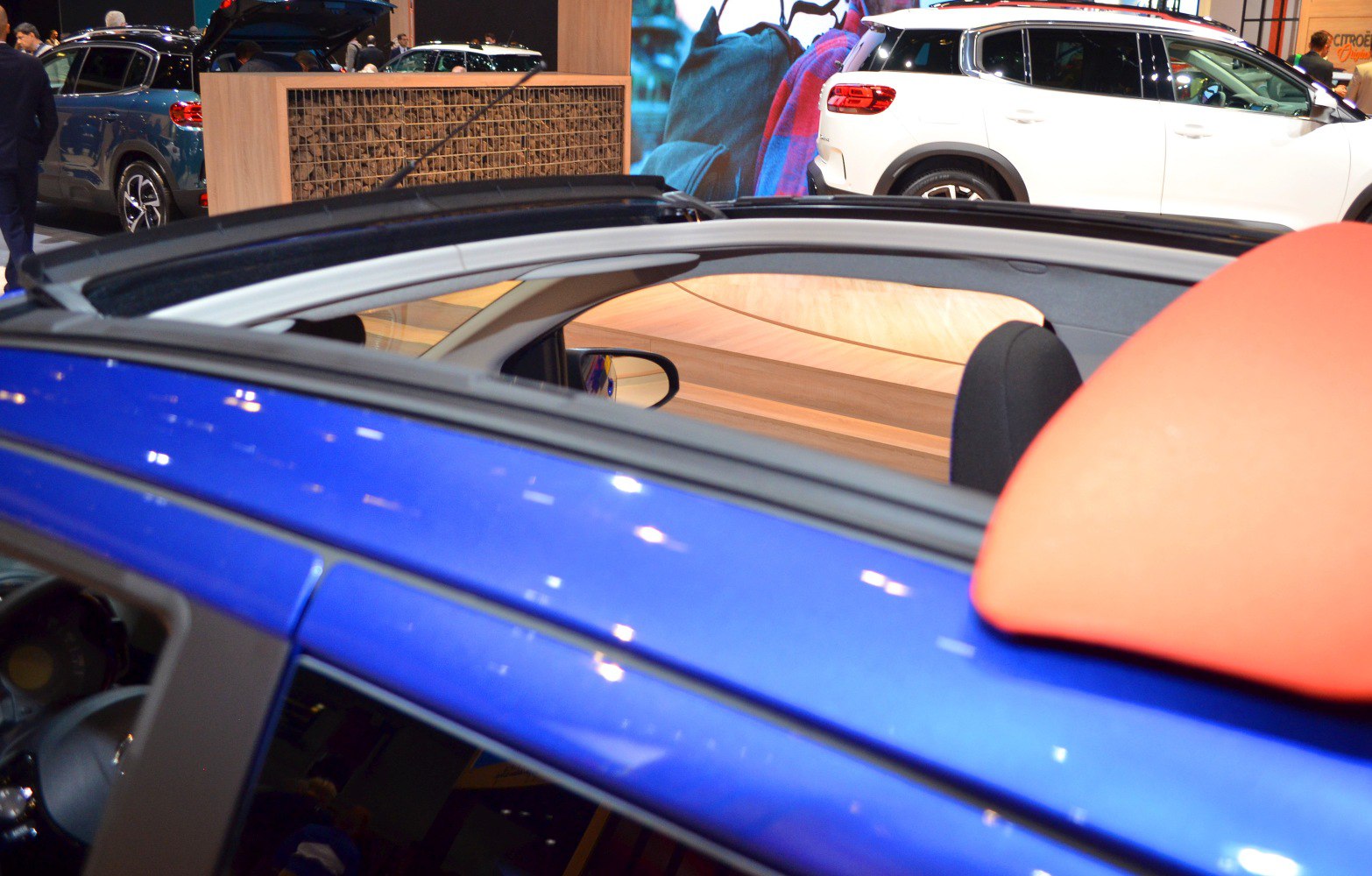 Convertible sunroof with open roof design and visible interior seating