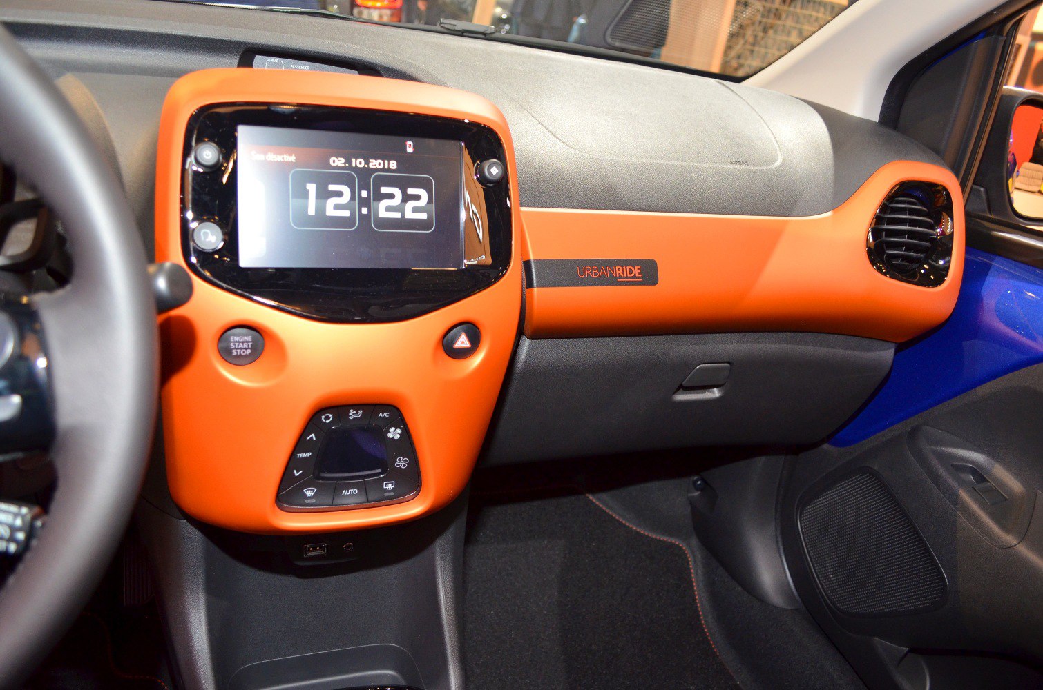 Touchscreen dashboard and Urban Ride orange trim in compact car interior