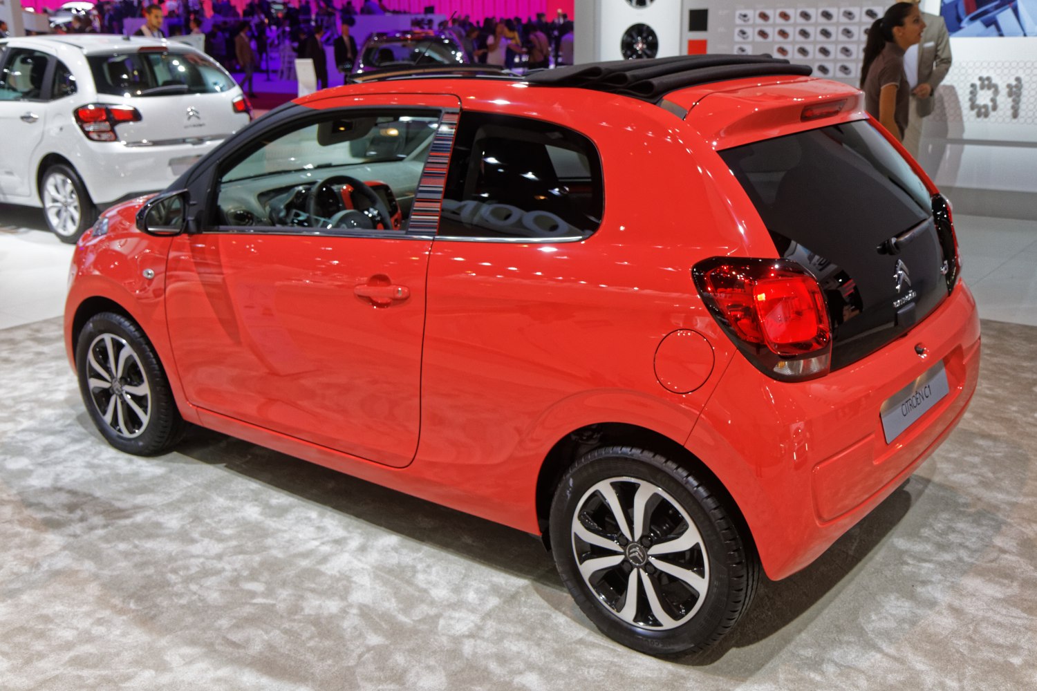 Rear and side view of a compact 3-door hatchback with distinctive tail lights and alloy wheels