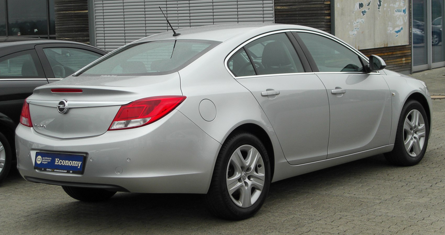 Rear and side view of a mid-size sedan with alloy wheels
