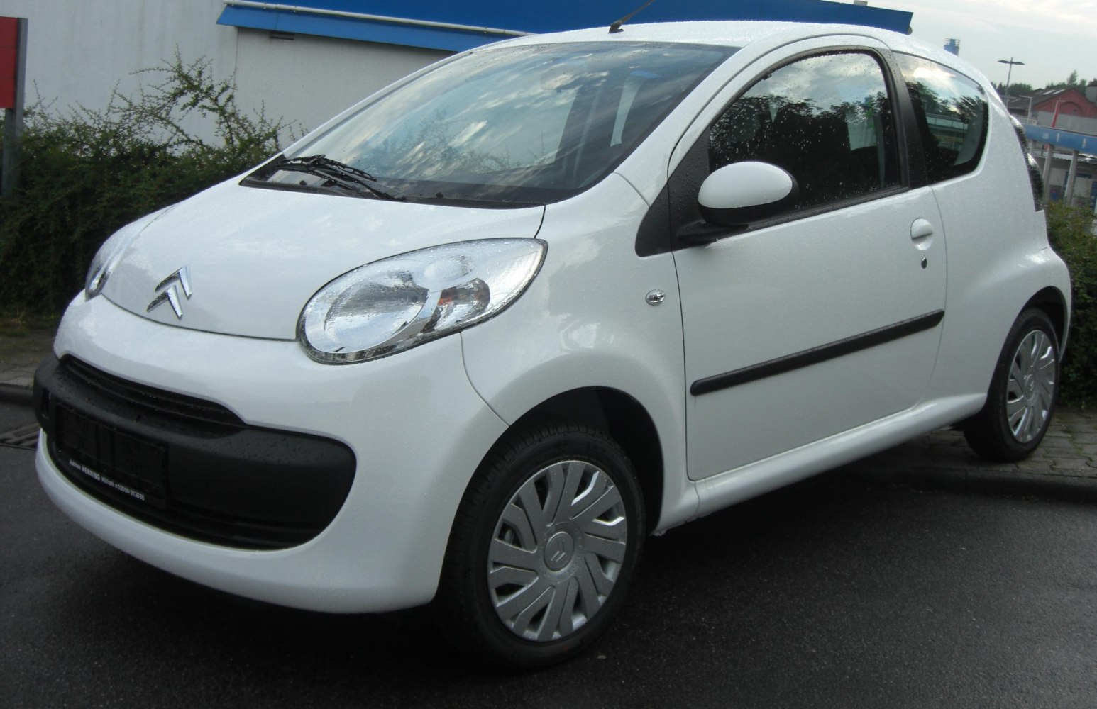 Compact 3-door hatchback front side with distinctive headlights