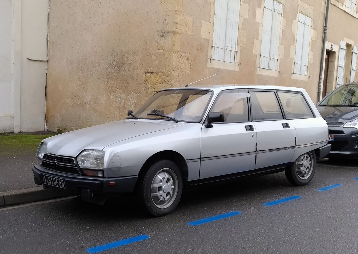 Silver angular four-door hatchback with alloy wheels and black trim