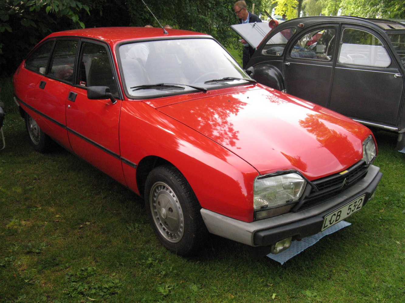 Red hatchback with angular headlights and aerodynamic body