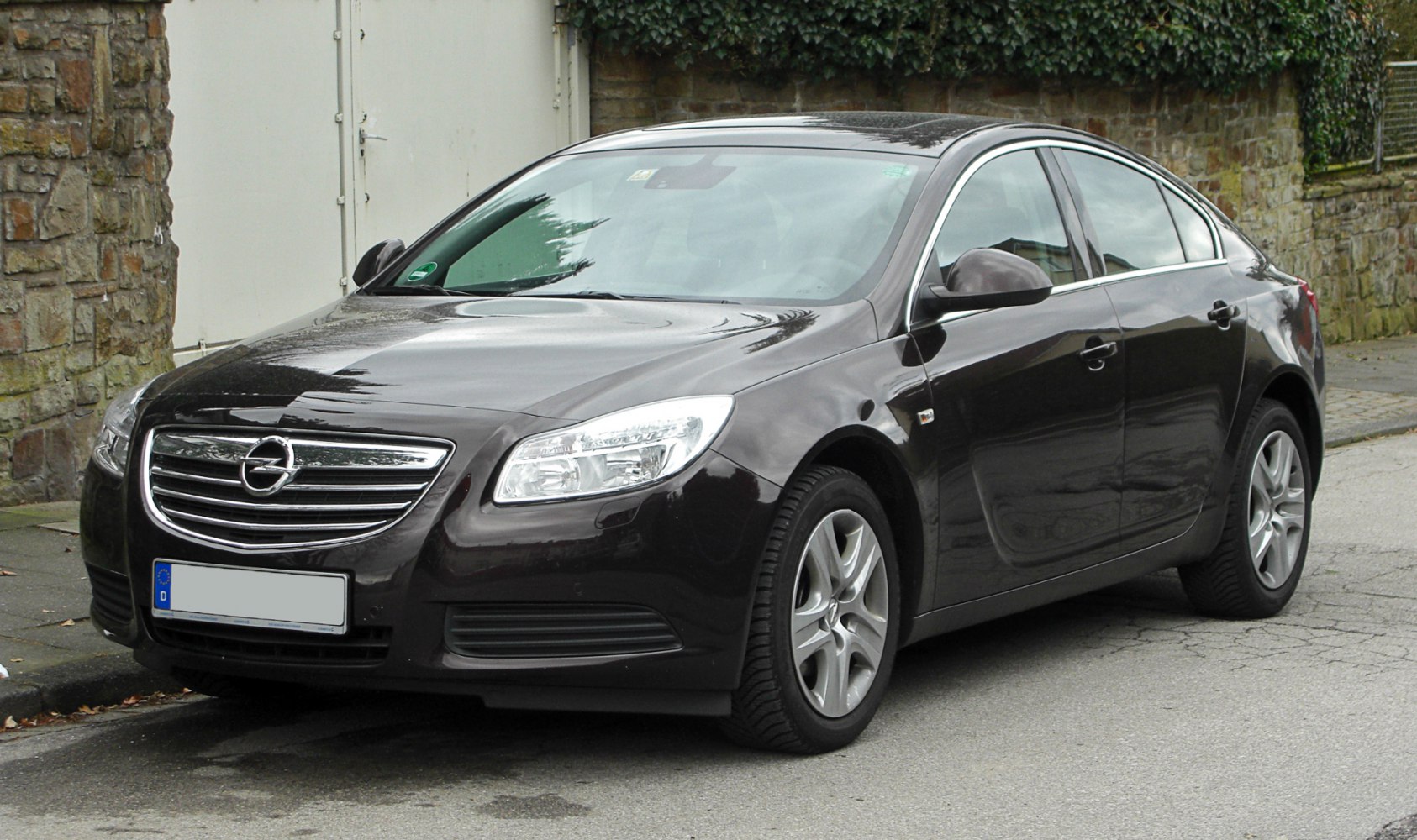 Mid-sized sedan with chrome grille and angled headlights